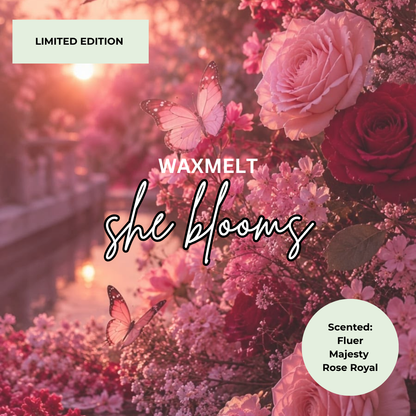 Scented wax melt packaging design for 'she blooms' by WAXMELT, featuring a romantic pink and red floral arrangement with butterflies in a sunlit garden scene. Includes 'LIMITED EDITION' and scent notes for 'Fluer', 'Majesty', and 'Rose Royal' in circular labels.